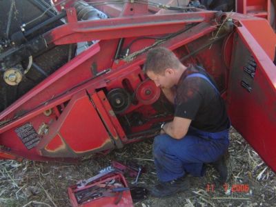Repairing the Combine in the sun and dust
